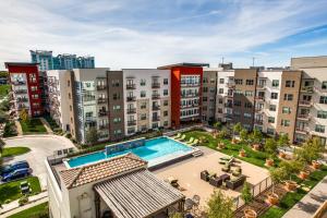 an aerial view of an apartment complex with a swimming pool at Locale Fort Worth in Fort Worth