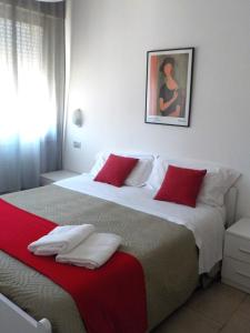 Postel nebo postele na pokoji v ubytování Hotel Migani