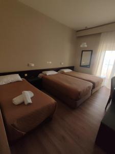 Postel nebo postele na pokoji v ubytování Plaza Hotel