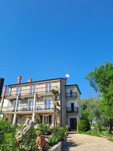 a building with balconies on the side of it at Apartments Marija in Murine