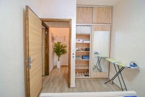 an open door to a room with a table and a plant at The Skyline Stay in Marrakech