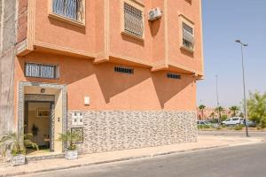 a building with a large shadow on the side of it at The Skyline Stay in Marrakech