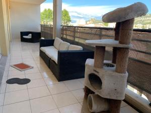 a living room with a bird house on a balcony at Droit au but!! in Marseille +3 photos