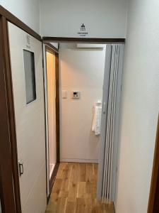 a hallway with a door leading to a bathroom at Kojinjuku - Vacation STAY 46728v in Setouchi