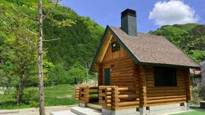 a small log cabin with a roof at New Kurumi Land - Vacation STAY 41991v 