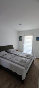 Postel nebo postele na pokoji v ubytování Apartman Fiora