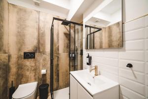 a bathroom with a sink and a shower at Tibur Domus B&B in Rome +64 photos