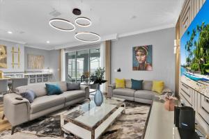 a living room with a couch and a table at Villa Grande in Orlando