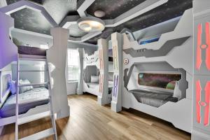 a childrens room with a star system mural at Villa Grande in Orlando +67 photos