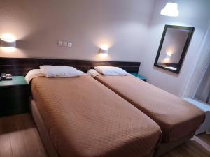 Postel nebo postele na pokoji v ubytování Plaza Hotel