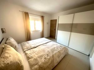 Posteľ alebo postele v izbe v ubytovaní Villa Perla