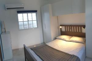 Postel nebo postele na pokoji v ubytování CasaMia RD B&B