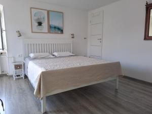 Postel nebo postele na pokoji v ubytování Apartments & Rooms Dinko