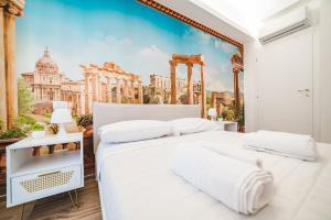 a bedroom with a wall mural of a city at Tibur Domus B&B in Rome