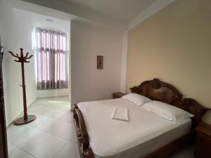 Postel nebo postele na pokoji v ubytování Hotel Latifi