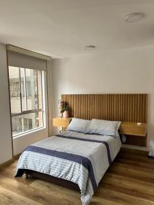 Säng eller sängar i ett rum på Maravilloso loft en la Candelaria, centro historico
