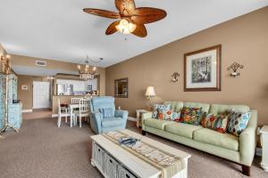a living room with a couch and a table at Ariel Dunes I 1404 in Destin