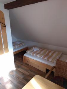 Postel nebo postele na pokoji v ubytování Penzion U Bušů