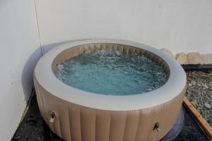a large circular pool of water in a building at Villa Bali Serenity in Stolac