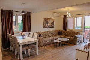 a living room with a couch and a table at Villa Bali Serenity in Stolac +93 photos