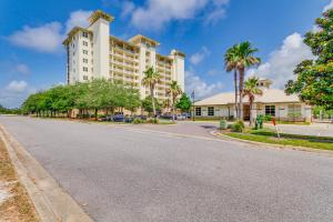 an empty street in front of a large building at Perdido Key Condo with Views and Golf Club Access! in Pensacola