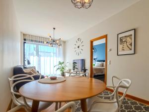a dining room with a table and chairs at Rotermann City Apartments Roseni in Tallinn