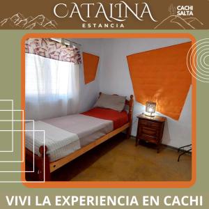 a small bedroom with a bed with a window at La Catalina in Cachí