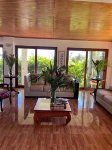 a living room with a couch and a coffee table at Teanehi Bed & Breakfast in Hanga Roa
