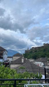 a view of a town with a castle on a hill at Andria's Apartment in Gjirokastër