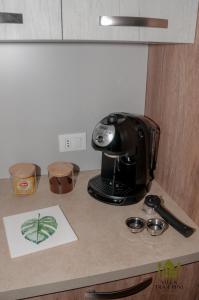 a coffee maker sitting on top of a counter at Villa Tra i Pini - Green & Relax in Castellana Grotte