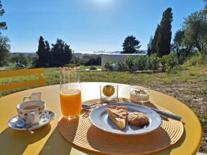 a table with a plate of food and drinks on it at Casale Valverde in Alghero +87 photos