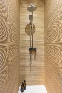 a shower with a shower head in a bathroom at Le Michigan Studio Near Paris in Aubervilliers