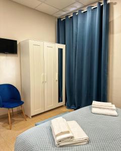 Postel nebo postele na pokoji v ubytování Sicily O'Clock Room