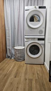 a washing machine and a dryer in a room at Aleksandria nad Olzą in Istebna