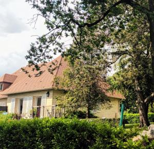 a yellow house with a brown roof at Mont Joly Gîte in Soumont-Saint-Quentin