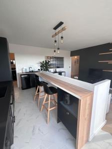 a kitchen with a large counter in a room at Appartement T2 en résidence privée in Maurepas