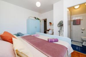 Ένα ή περισσότερα κρεβάτια σε δωμάτιο στο Apartment Villa Strenja