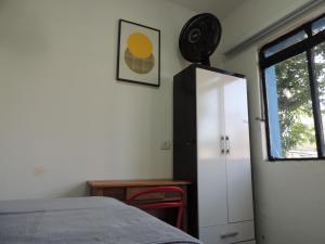 a bedroom with a bed and a clock on the wall at room itaim in Sao Paulo