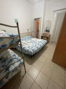Postel nebo postele na pokoji v ubytování Hotel Vienna Rivazzurra