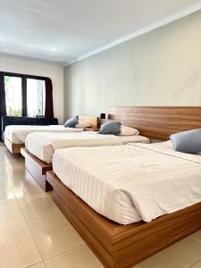 Postel nebo postele na pokoji v ubytování Radha Bali Hotel + 37 fotografií