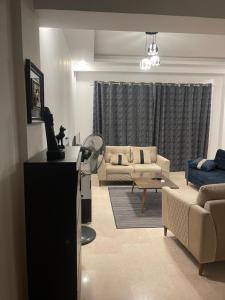 a living room with a couch and a table at Neama town in Sharm El Sheikh +3 photos