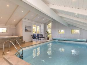 a swimming pool in a house with an attic at 10 person holiday home in L kken in Løkken