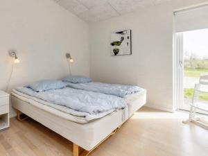 Postel nebo postele na pokoji v ubytování Holiday home Brovst VIII