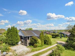 an aerial view of a house with trees at 6 person holiday home in Glesborg in Glesborg