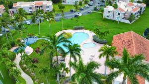 an aerial view of a resort with a swimming pool at Daria Beachfront community steps 2 pool- Generator in Sabana