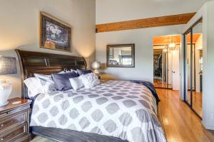 a bedroom with a bed and a wooden floor at 1 Mi to Lake Tahoe Home with Hot Tub and Decks in Tahoe City
