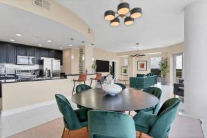 a dining room and kitchen with a table and chairs at FL King Velvet Suite- 3bdrm/2Bath-2000 sq ft in Orlando