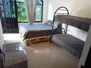 a room with two bunk beds and a window at CASA VACACIONAL SAMARIA in Flandes +24 photos