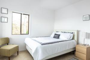מיטה או מיטות בחדר ב-Panoramic View Home
