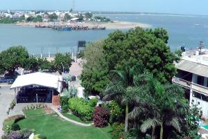 an aerial view of a resort and the water at Hotel Apaar in Diu